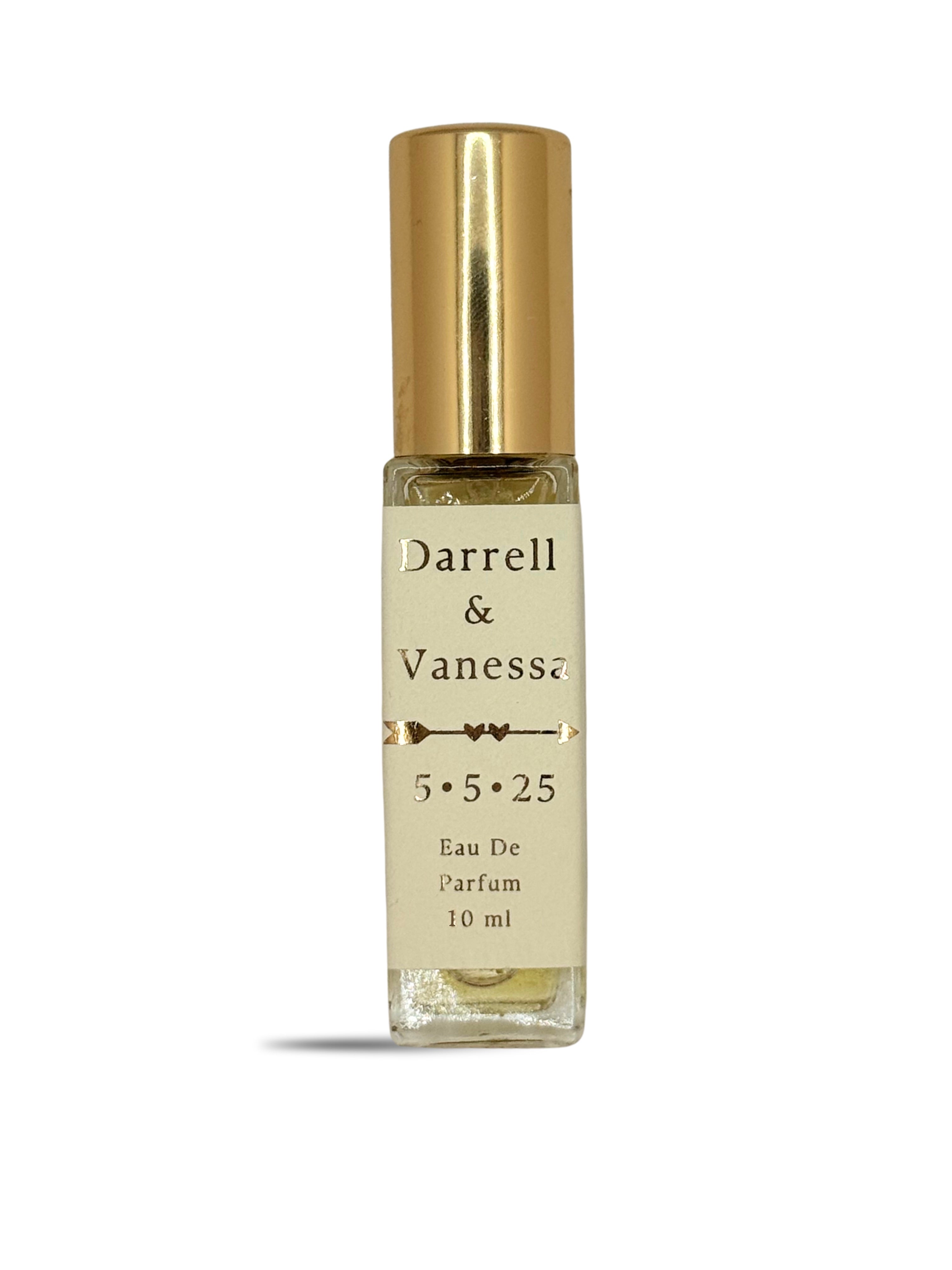 A 10 ml roll-on perfume bottle with a gold metallic cap, metallic gold letters and a cream-colored label. The label reads 'Darrell & Vanessa.